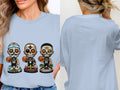 T-shirt featuring three sugar skull-style basketball players with Spurs jerseys.