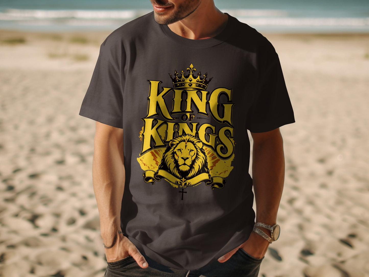 Dark t-shirt with gold "King of Kings" text, lion, and cross graphic.