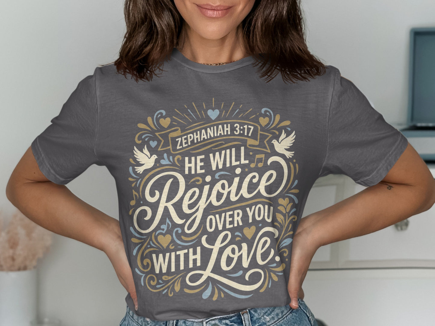 Zephaniah 3:17 graphic on a grey t-shirt with text "He will rejoice over you with love".