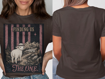 Dark brown t-shirt with "Finding Us The One" text and a sheep in a mountainous landscape.
