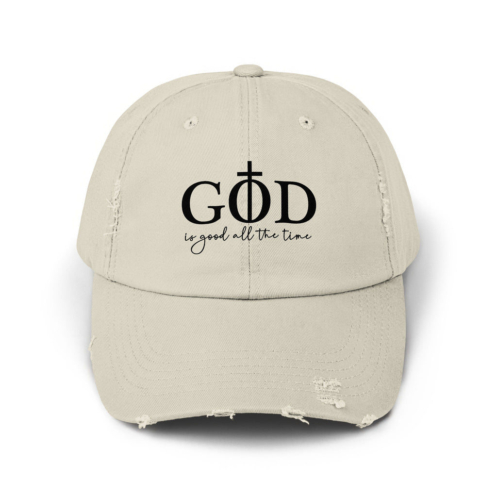 Light tan distressed baseball cap with black text "GOD is good all the time".