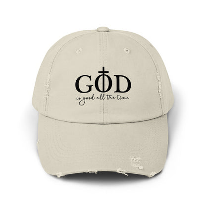 Light tan distressed baseball cap with black text "GOD is good all the time".
