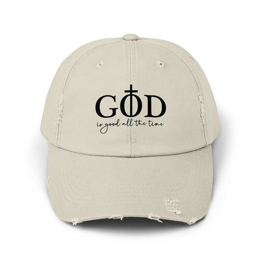 Light tan distressed baseball cap with black text "GOD is good all the time".
