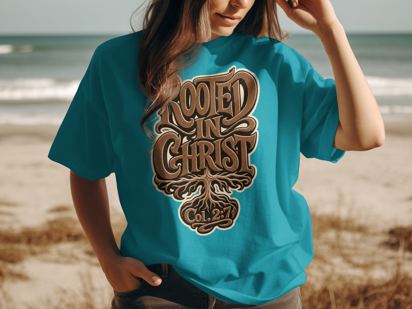 Teal t-shirt with "Rooted in Christ Col. 2:7" graphic and tree roots.