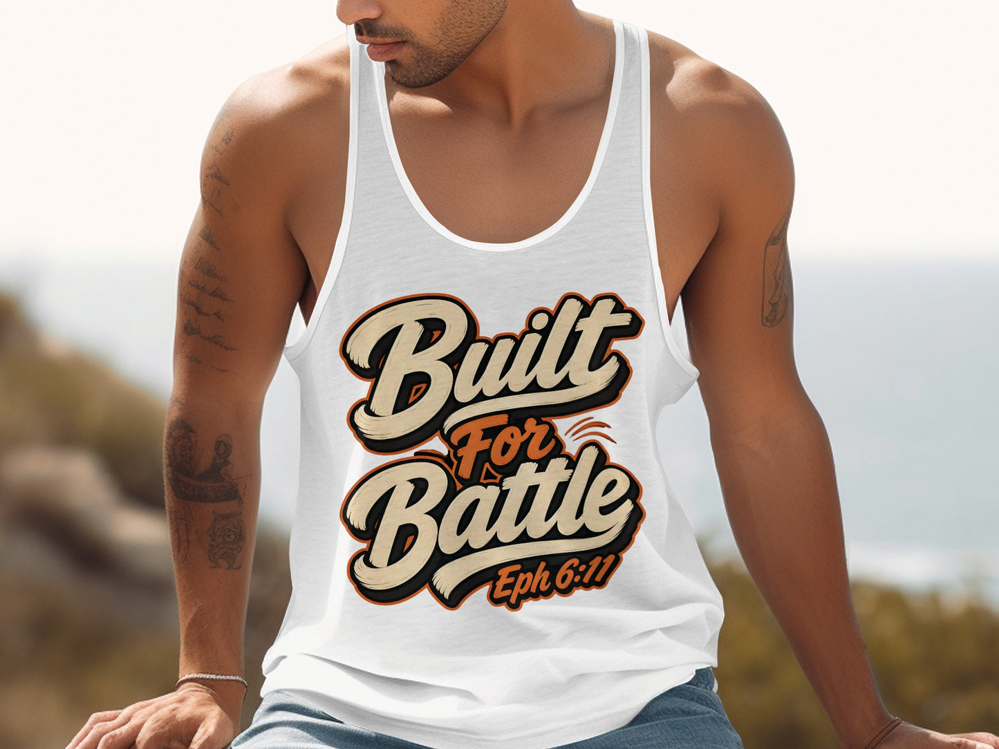 White tank top with "Built For Battle Eph 6:11" text in orange and cream.