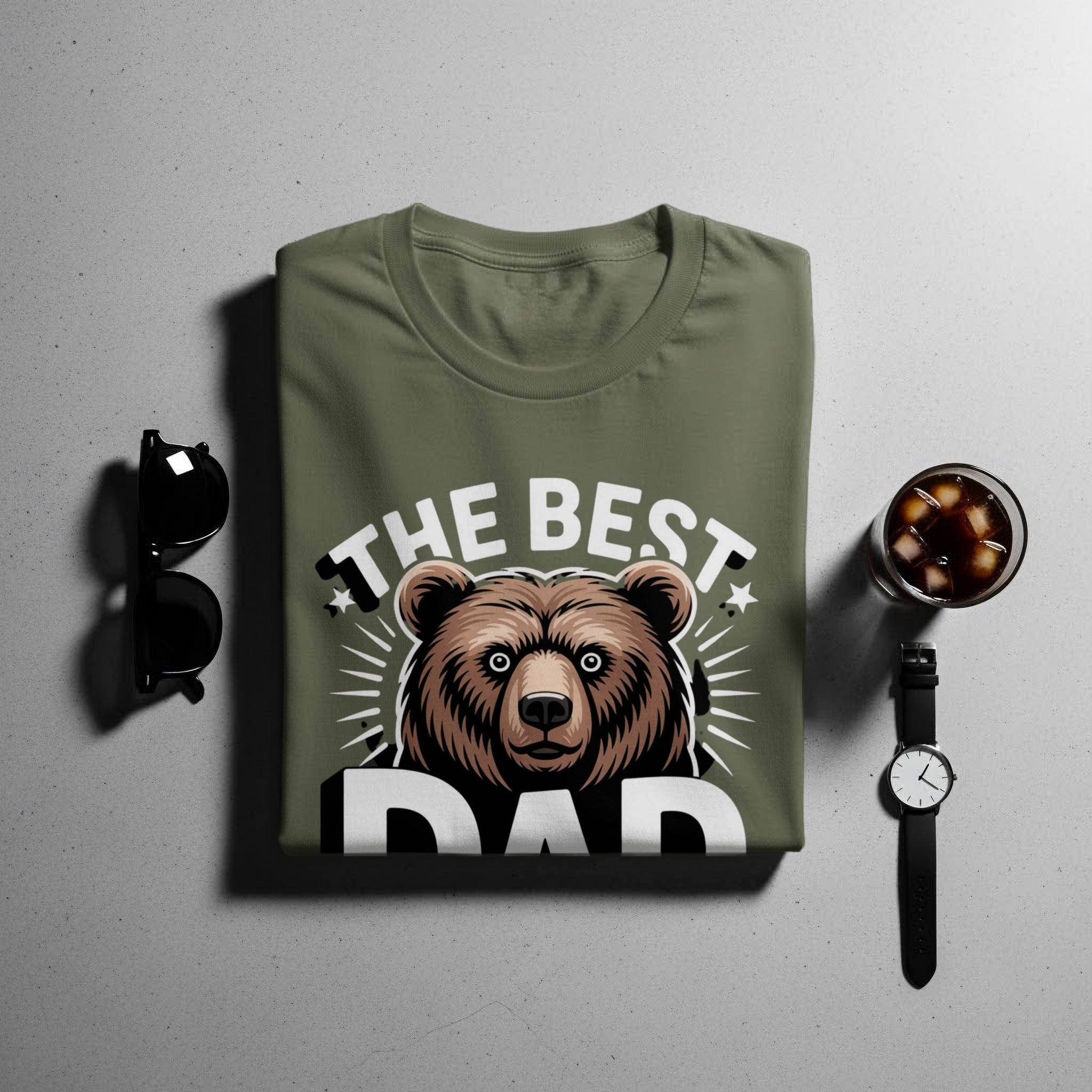 Olive t-shirt with text "THE BEST DAD" and bear graphic.