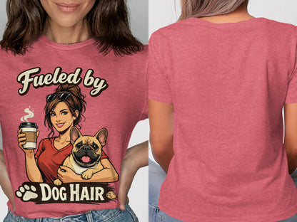 Pink t-shirt with graphic of woman holding French bulldog and text "Fueled by Dog Hair".
