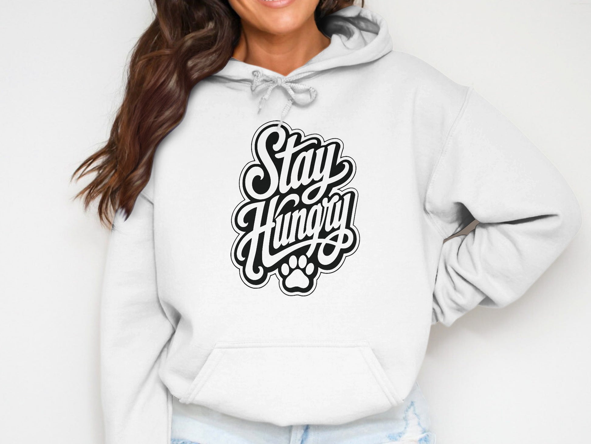 White hoodie with black "Stay Hungry" text and paw print graphic.