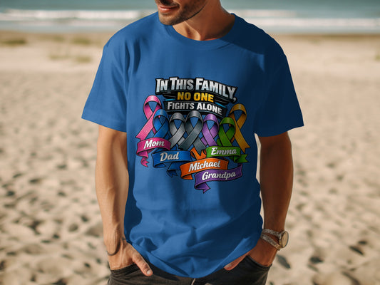 Blue t-shirt with "In This Family, No One Fights Alone" and family names.