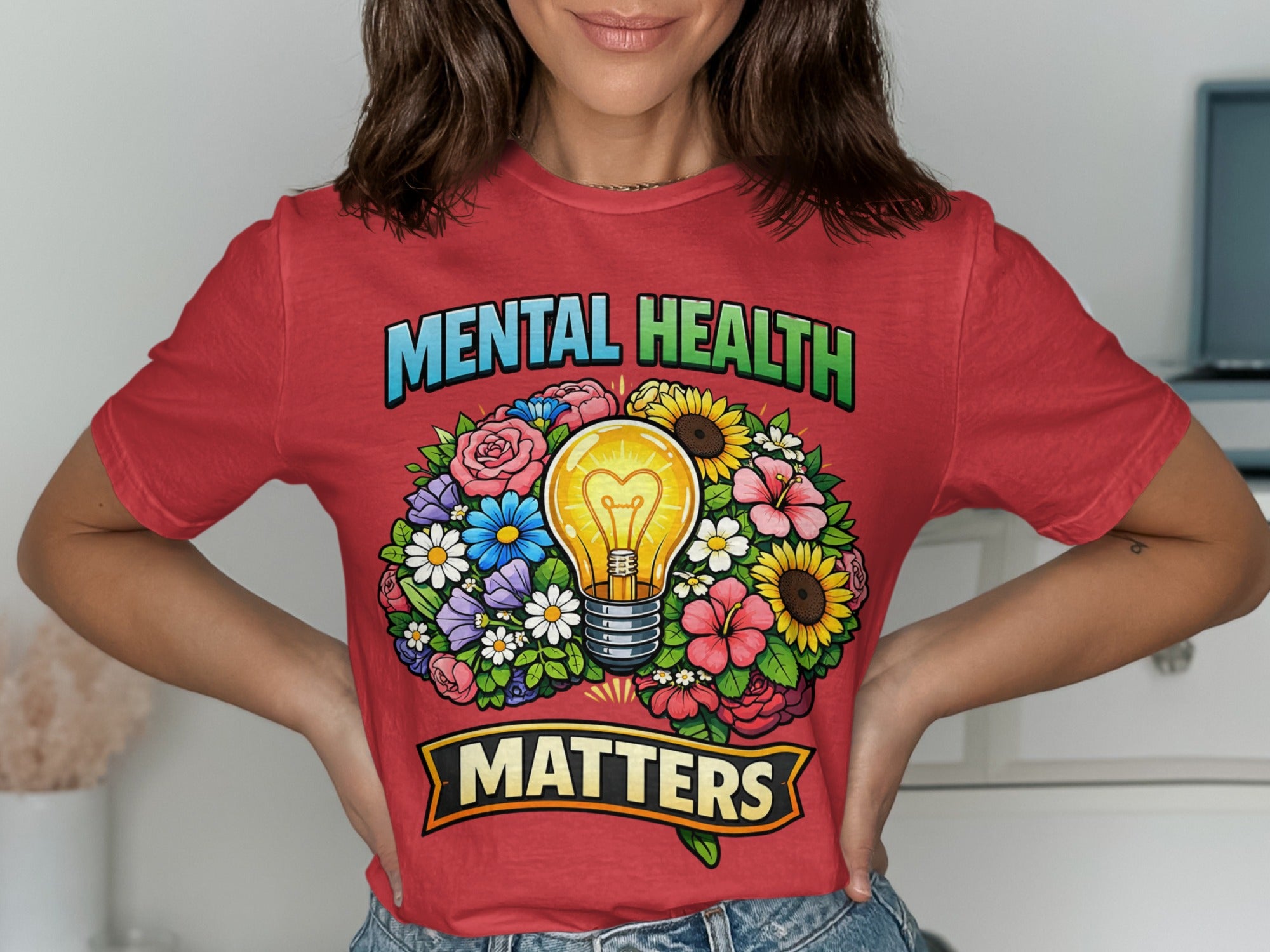 Red t-shirt with "Mental Health Matters" text surrounding a lightbulb in a floral wreath.