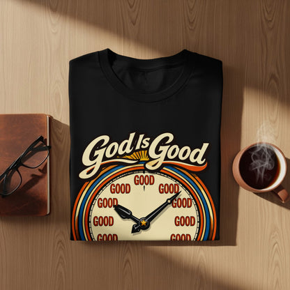 Black t-shirt with "God Is Good" text and a clock graphic with "GOOD" on the face.