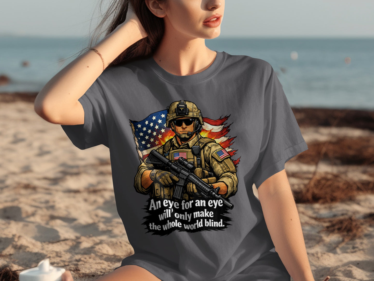 Graphic tee with soldier, American flag, and text "An eye for an eye will only make the whole world blind."