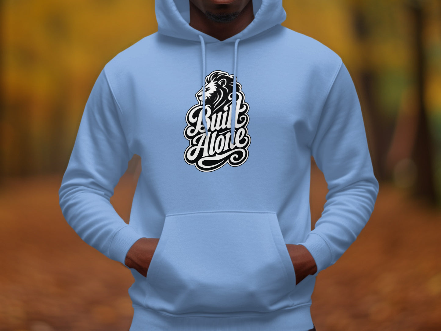 Light blue hoodie with black and white lion head and "Built Alone" text graphic.