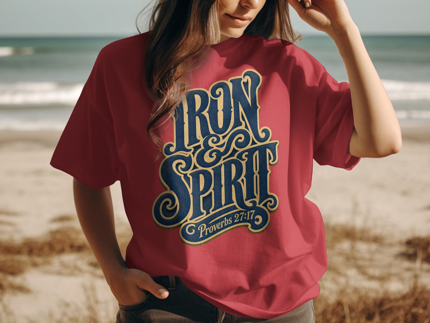 Red t-shirt with "Iron & Spirit Proverbs 27:17" in blue and gold vintage lettering.