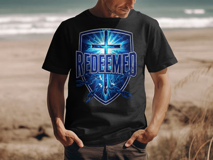 Black t-shirt with "REDEEMED" and cross graphic with broken chains.