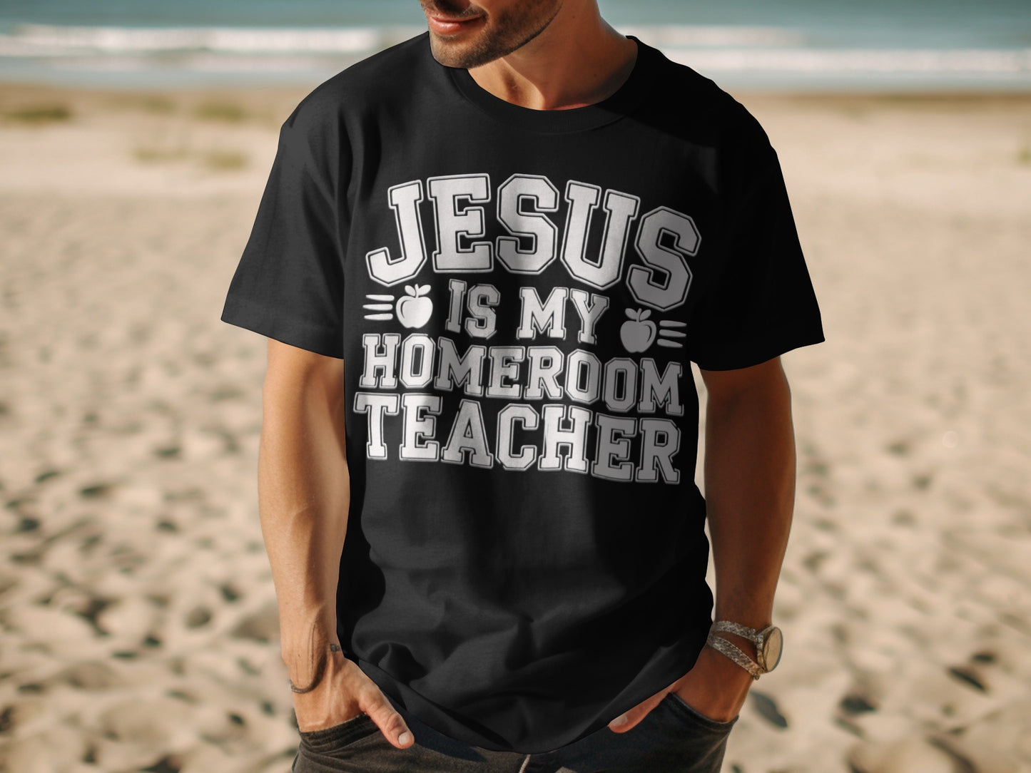 Black t-shirt with white text "JESUS IS MY HOMEROOM TEACHER" and apple graphics.