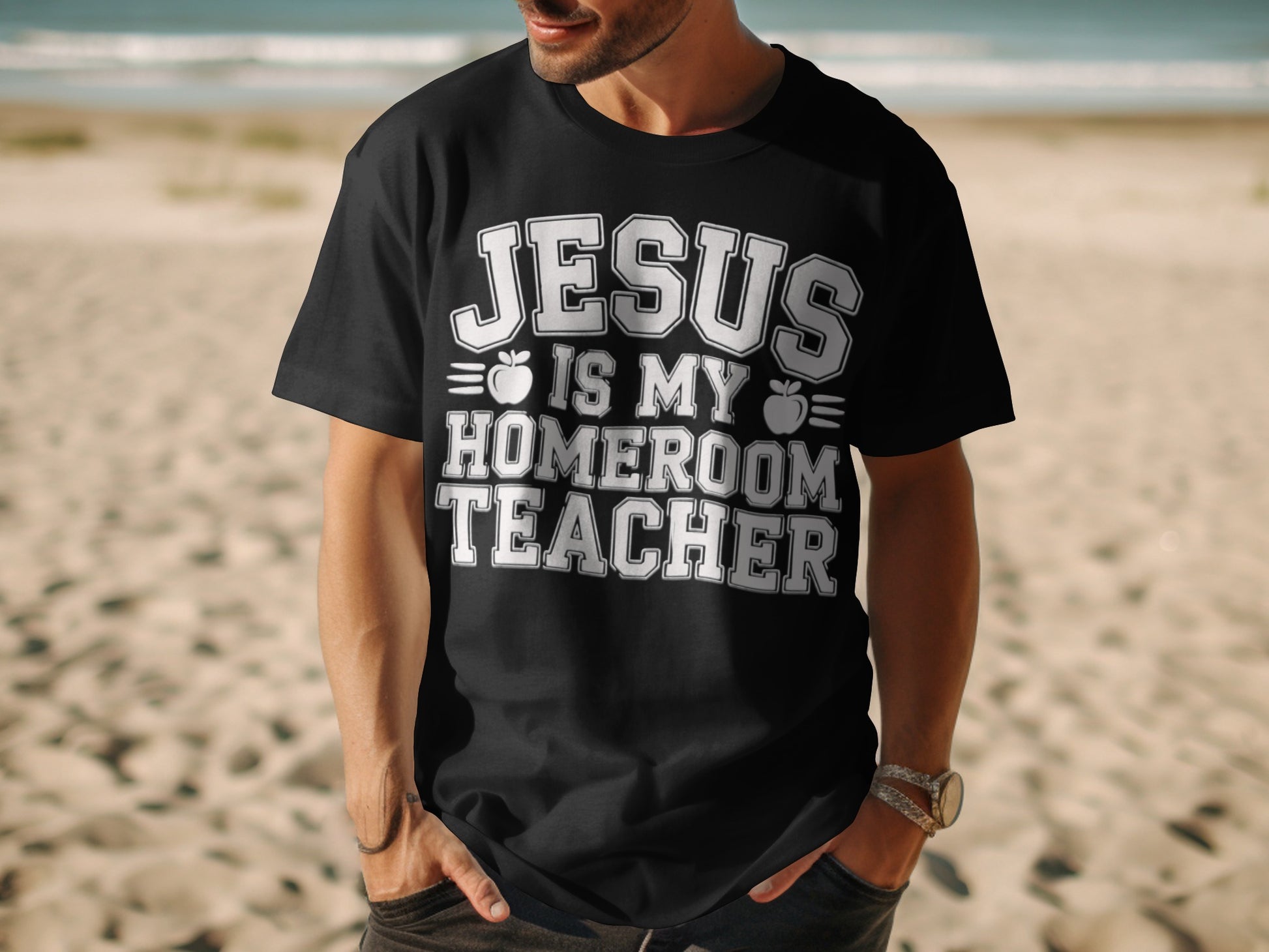 Black t-shirt with white text "JESUS IS MY HOMEROOM TEACHER" and apple graphics.