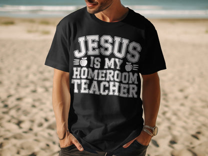 Black t-shirt with white text "JESUS IS MY HOMEROOM TEACHER" and apple graphics.