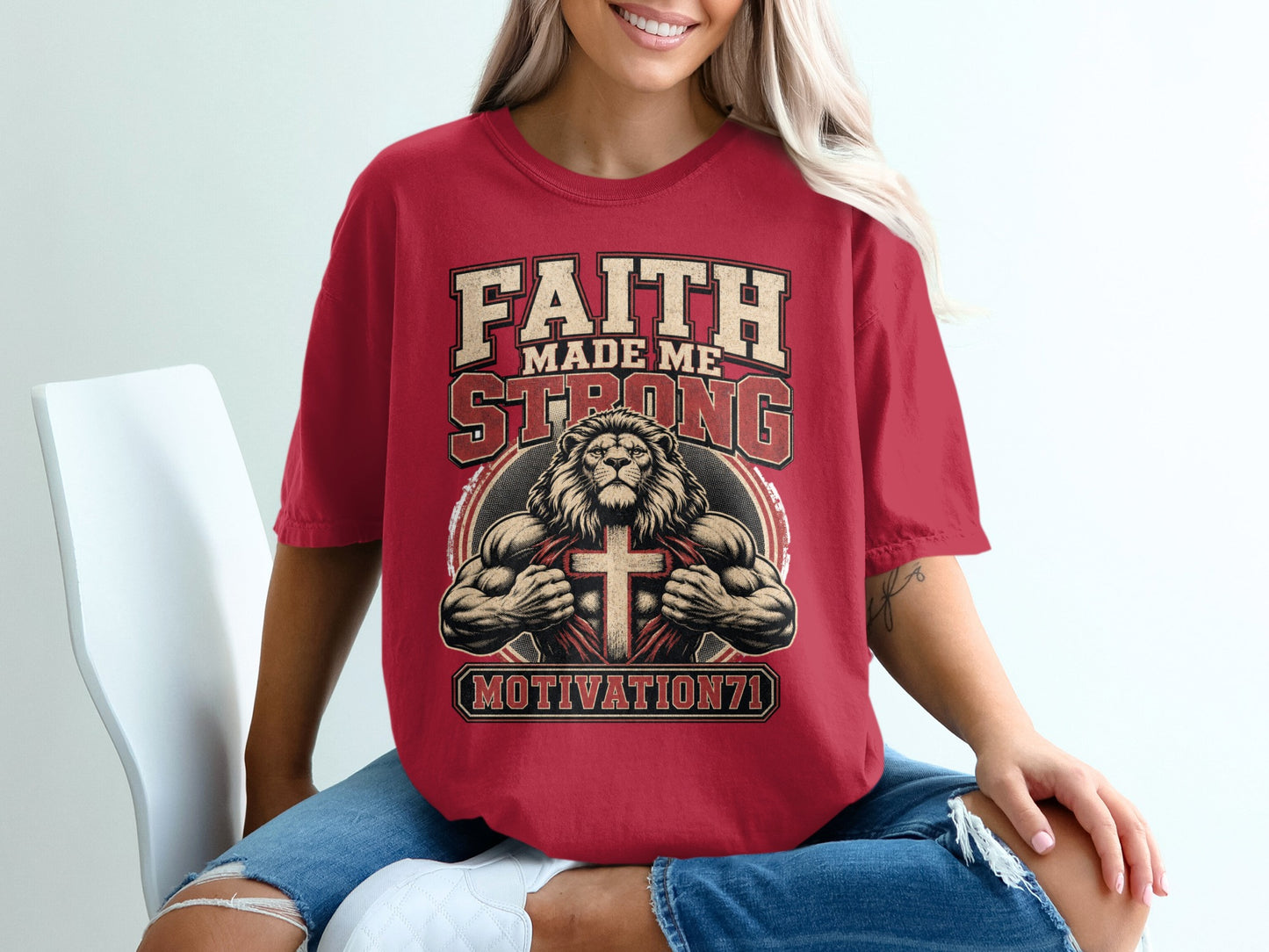 Red t-shirt with "Faith Made Me Strong" text, muscular lion, and cross graphic.