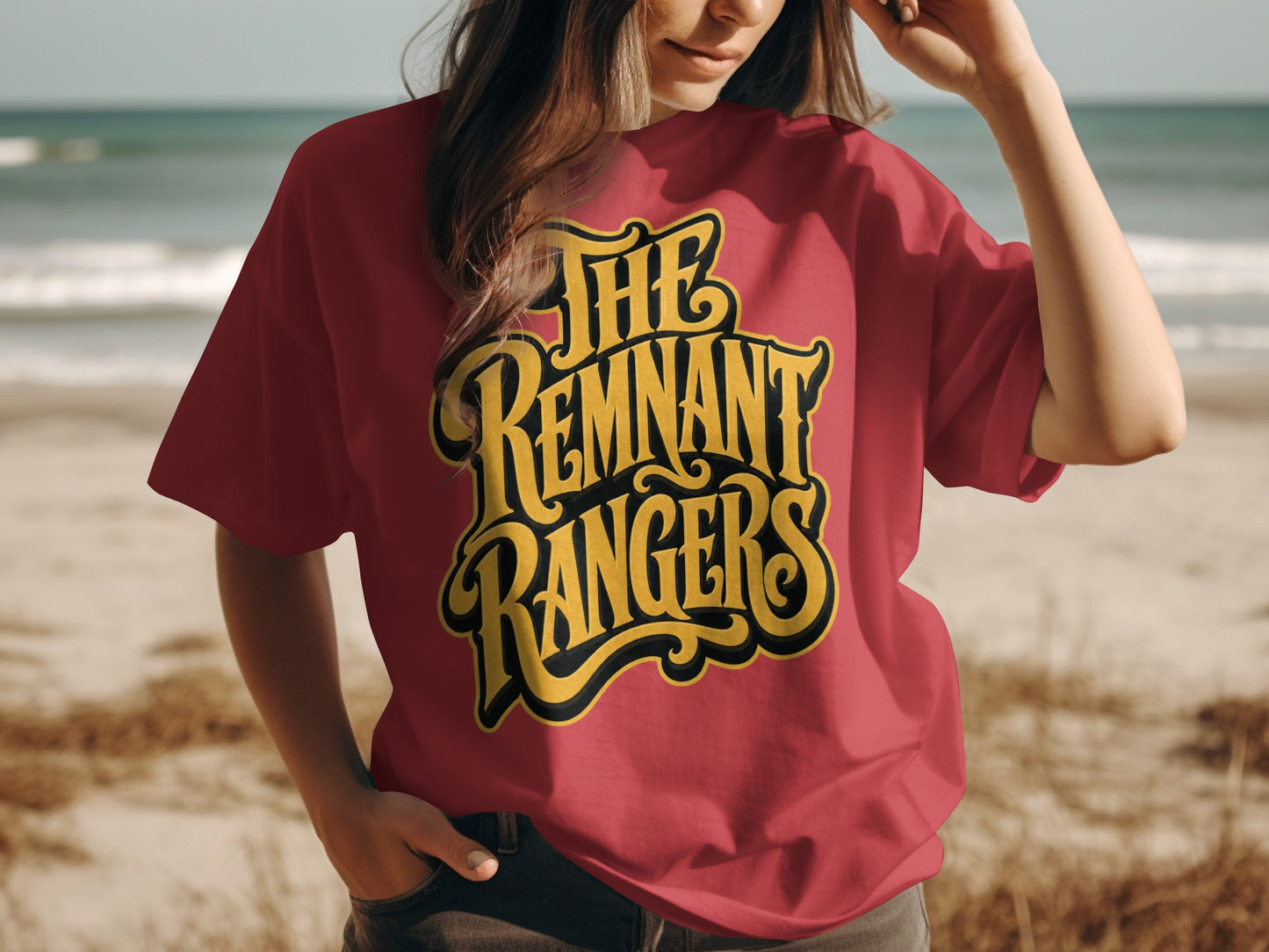 Red t-shirt with yellow and black "The Remnant Rangers" text on a beach background.