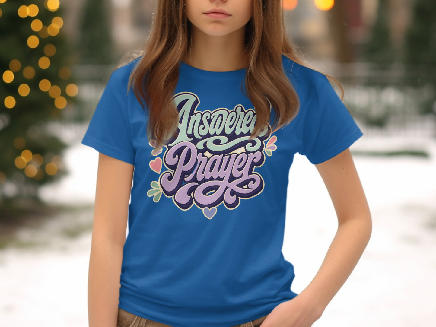 Blue t-shirt with "Answered Prayer" in colorful, retro script and hearts.