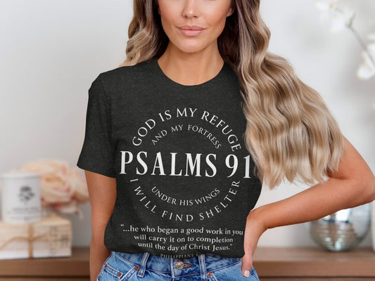 Dark t-shirt with text: God is my refuge, Psalms 91, and Philippians 1.