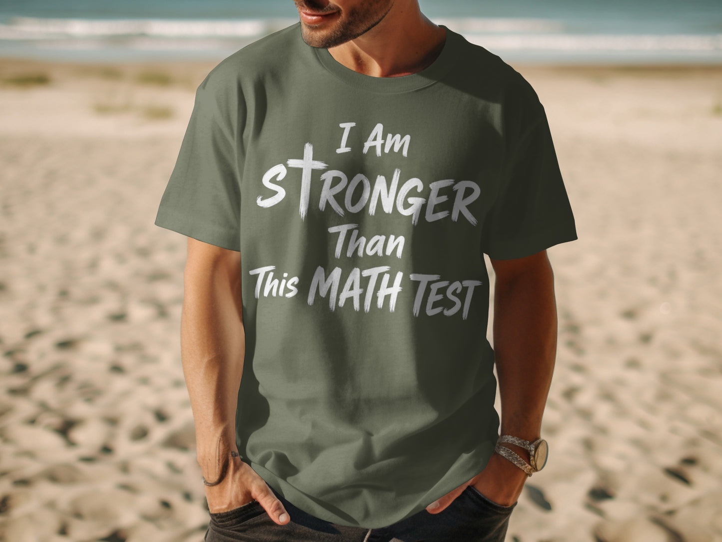 Green t-shirt with white text "I Am Stronger Than This MATH TEST".