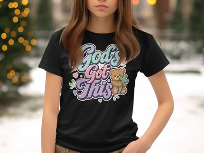 Black t-shirt with "God's Got This" text and a bear holding a cross.