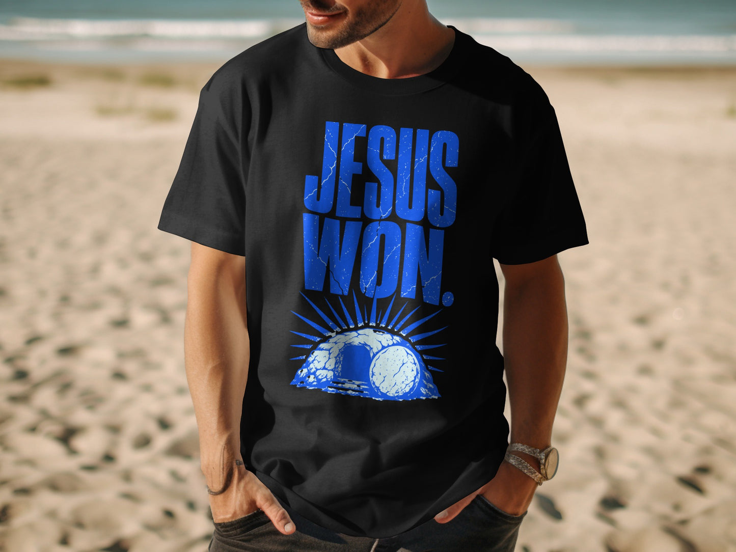 Black t-shirt with blue "JESUS WON." text and a tomb graphic.