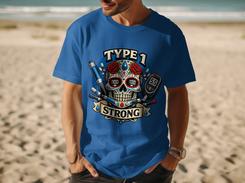 Blue t-shirt with skull art, "Type 1 Strong" text, syringe, and blood glucose meter.