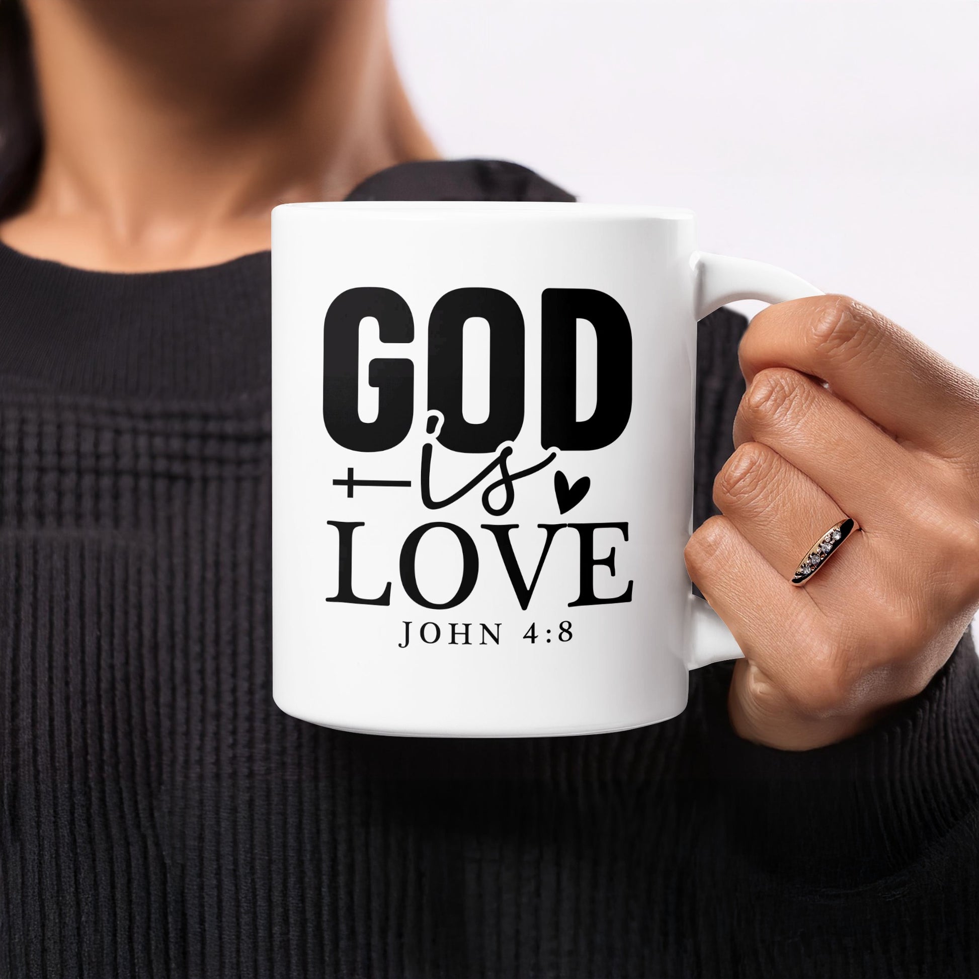 White mug with black text "GOD is LOVE" and "JOHN 4:8".
