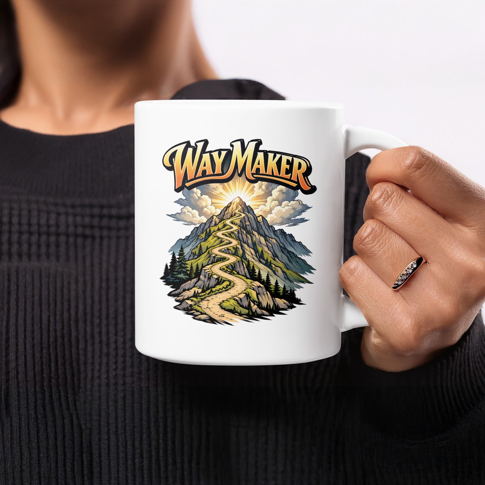 White mug with graphic of winding road up a mountain with "Way Maker" text.