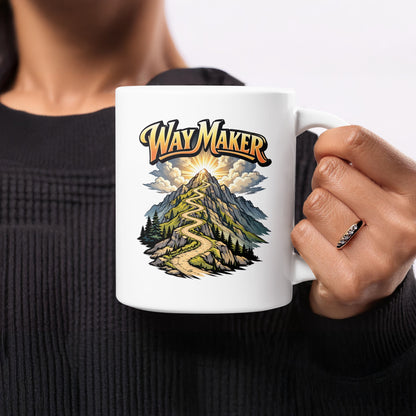 White mug with graphic of winding road up a mountain with "Way Maker" text.