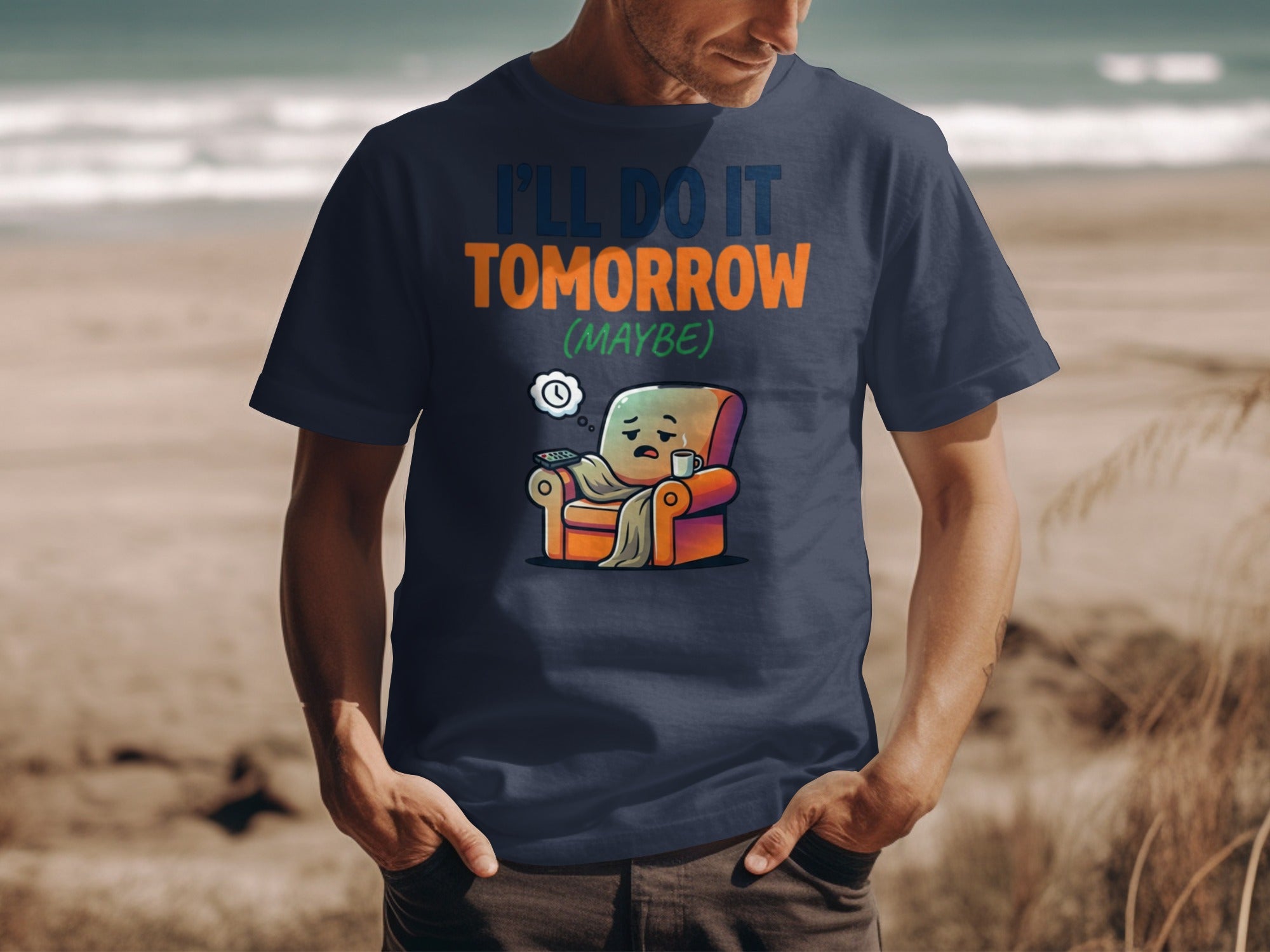 T-shirt with "I'LL DO IT TOMORROW (MAYBE)" text and cartoon of person in armchair.