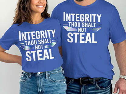 Two people wearing blue t-shirts that say "Integrity Thou Shalt Not Steal."