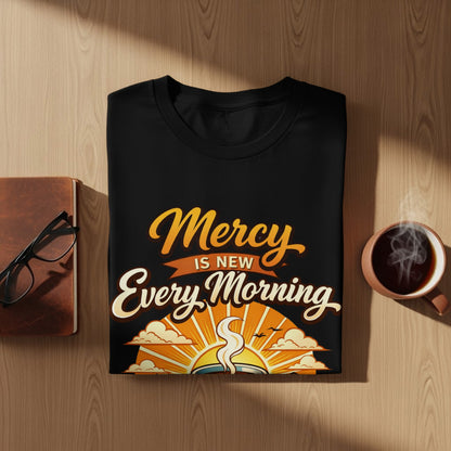 Black t-shirt with text "Mercy is new every morning" and a sunrise graphic.