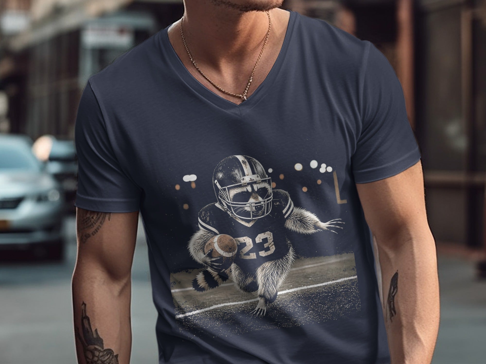 T-shirt graphic: Raccoon in football uniform carrying a football on the field.