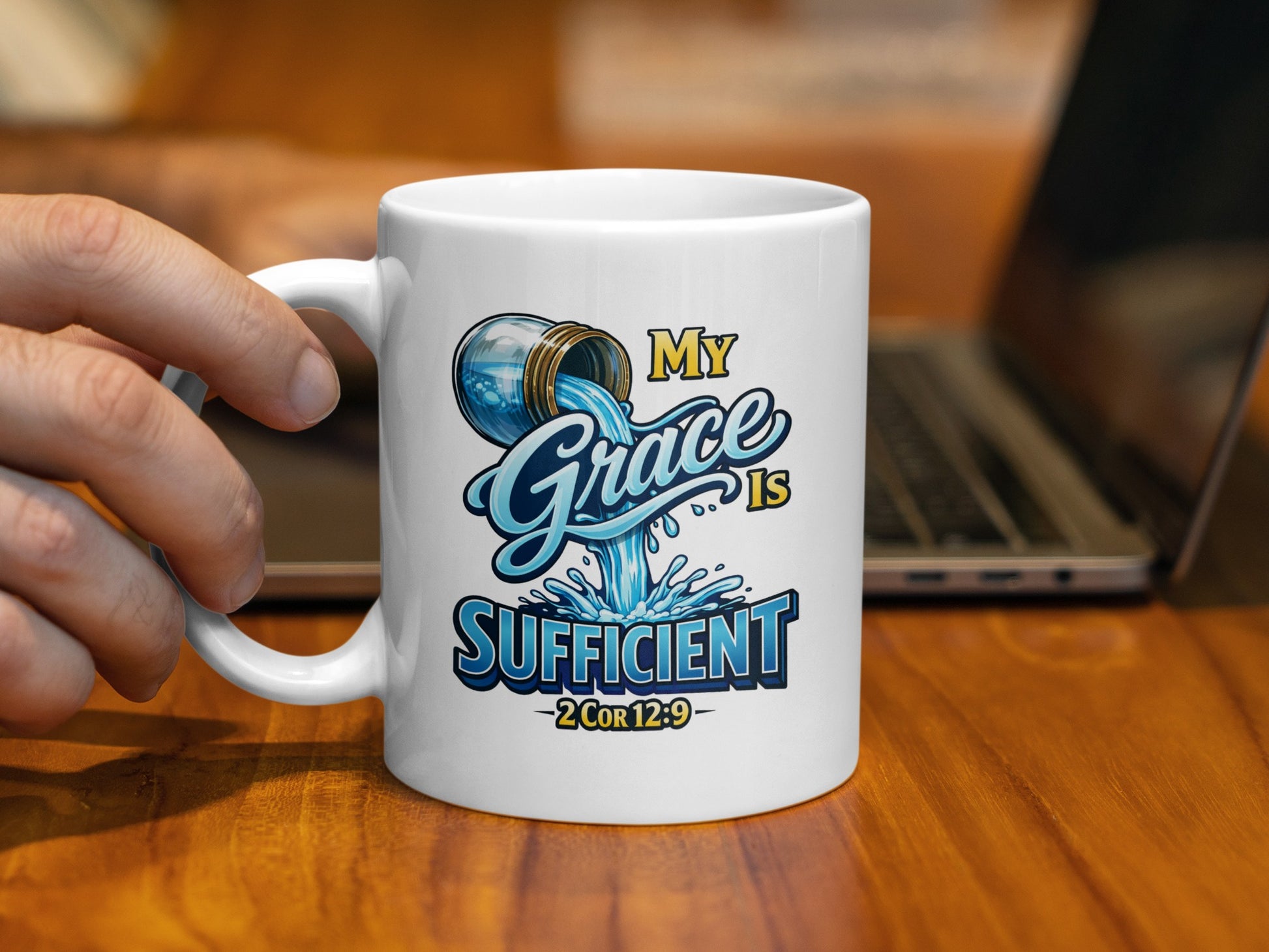 White mug with "My Grace is Sufficient 2Cor 12:9" text and water graphic.