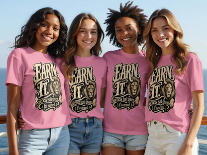 Four women in pink t-shirts with lion and text graphics on them.