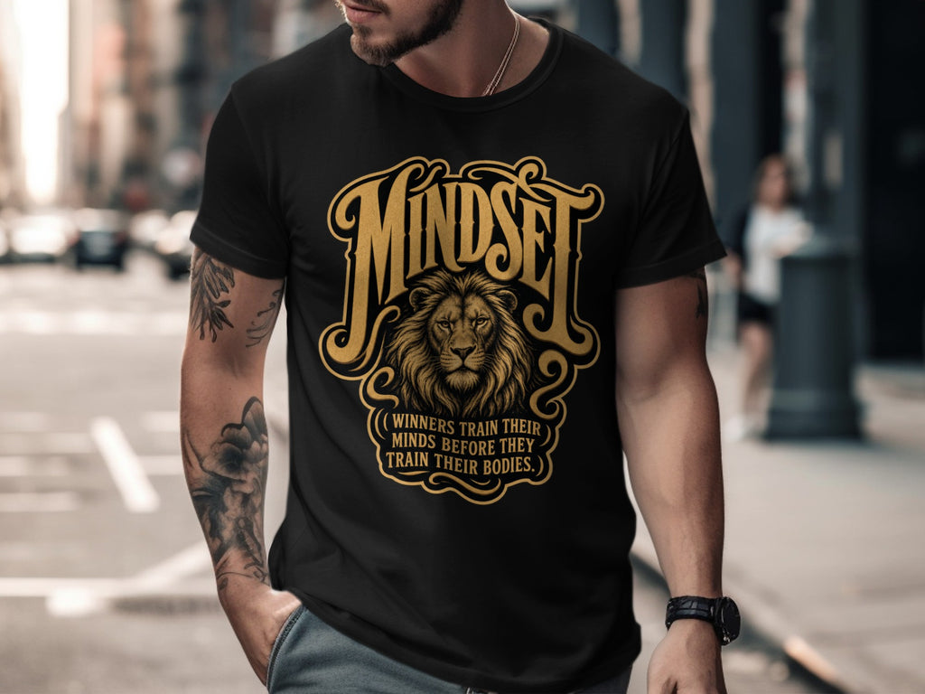 Black t-shirt with golden lion graphic and text "Mindset: Winners train their minds before they train their bodies."