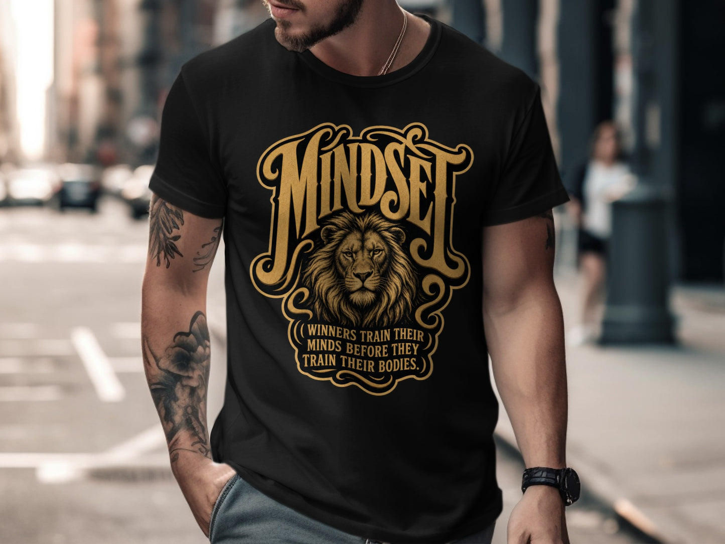 Black t-shirt with golden lion graphic and text "Mindset: Winners train their minds before they train their bodies."