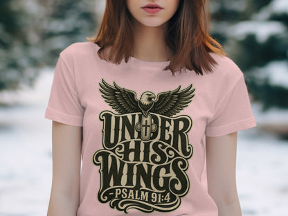 Pink t-shirt with eagle graphic and text "UNDER HIS WINGS -PSALM 91:4".