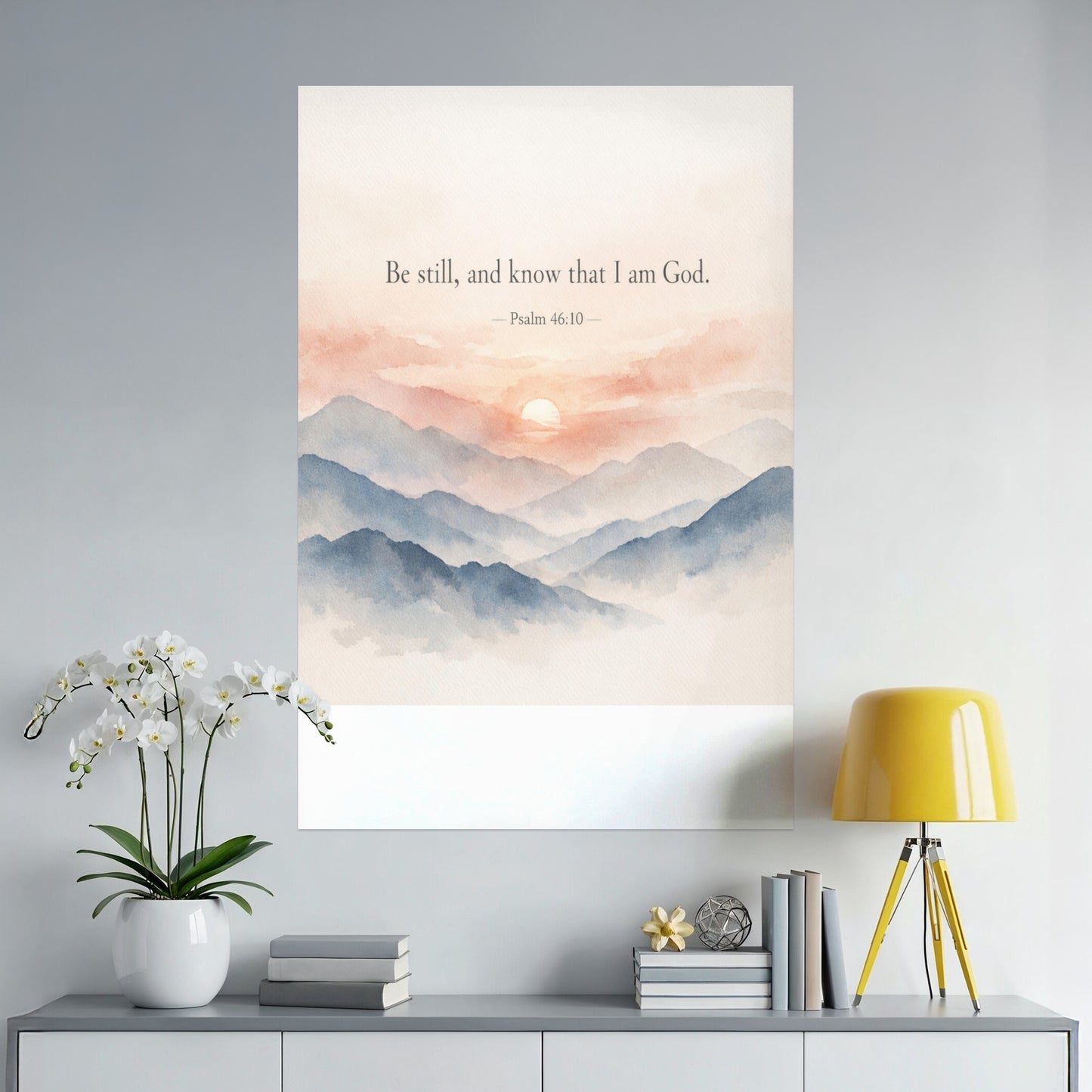 Watercolor print of mountains at sunset with text "Be still, and know that I am God. - Psalm 46:10."