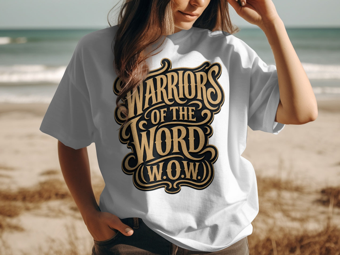 White t-shirt with gold text that reads "WARRIORS OF THE WORD (W.O.W.)".