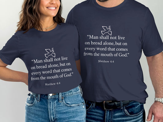 Navy t-shirts with white text and a dove graphic: "Man shall not live on bread alone."