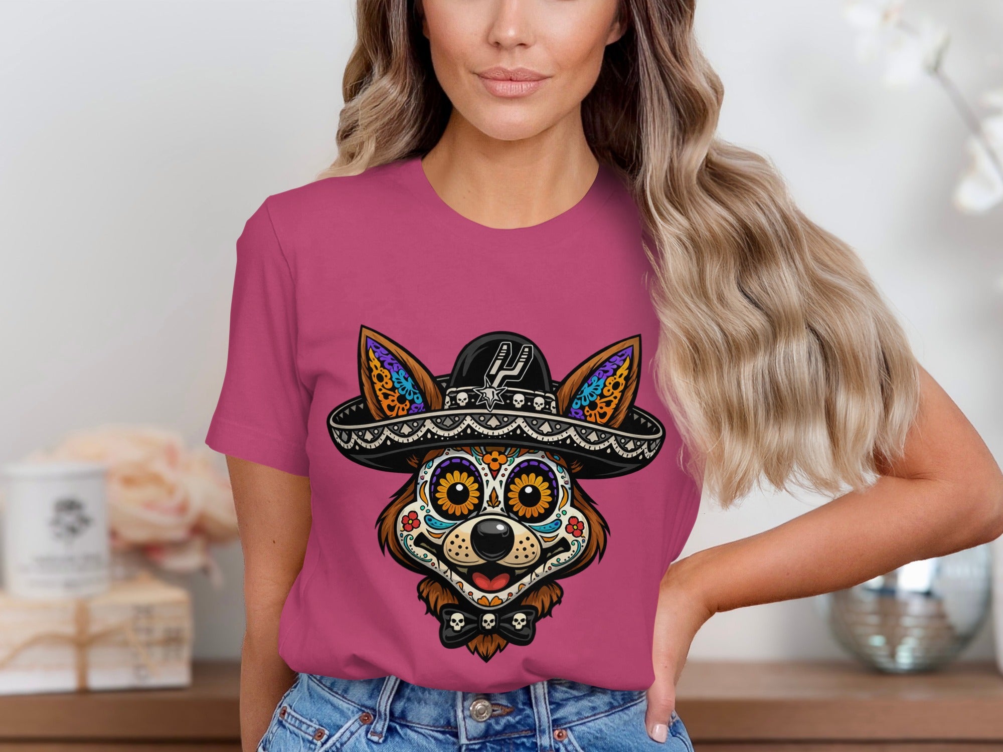 Pink t-shirt with sugar skull dog wearing a sombrero and bowtie graphic.