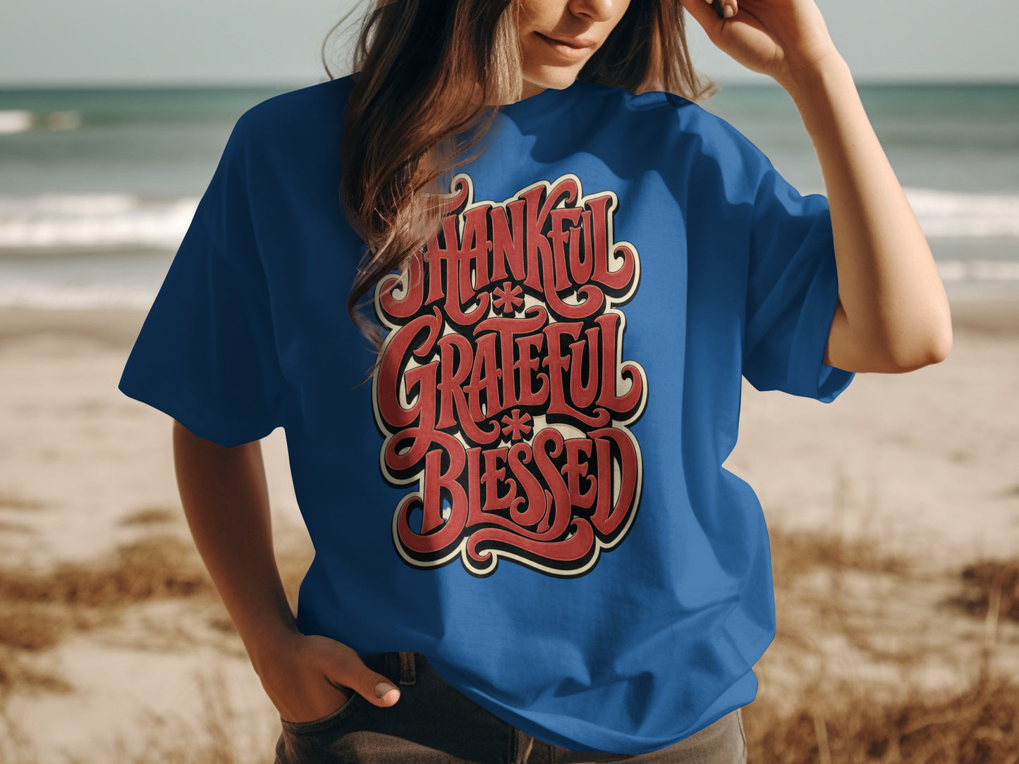 Blue t-shirt with "Thankful Grateful Blessed" text in red and cream lettering.