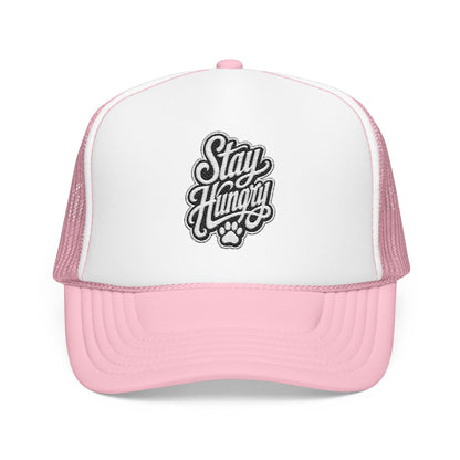 Pink trucker hat with "Stay Hungry" text and paw print graphic.
