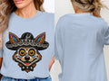 Light blue t-shirt front with dog skull-face graphic wearing a sombrero; back view.