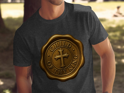 Dark grey t-shirt with a golden wax seal emblem with a cross and "Child of the King" text.